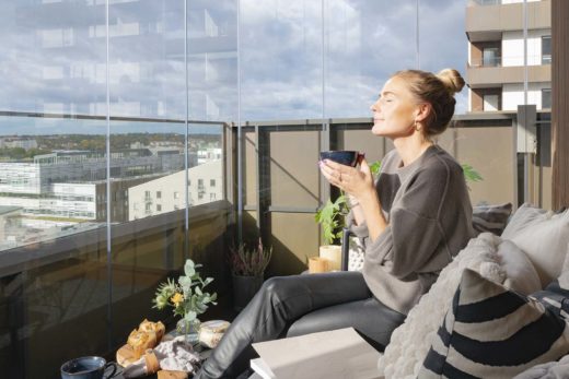 Women enjoying her Lumon balcony glazing