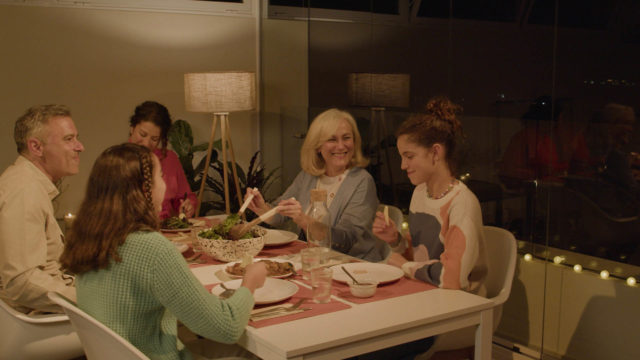 Family enjoying dinner in Lumon enclosure