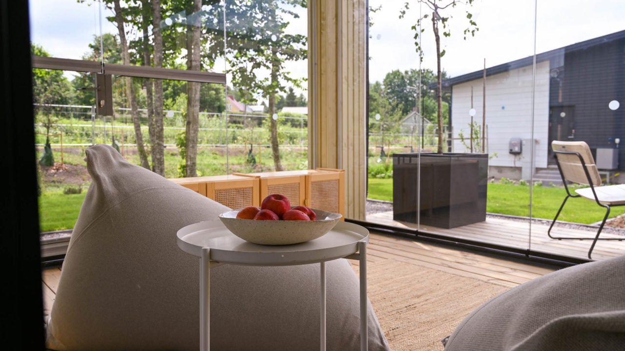 Lumon sunroom with glass walls and patio glazing